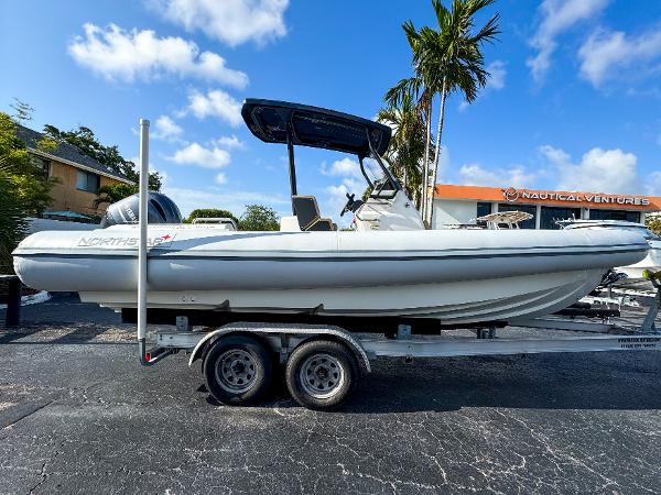 Northstar Orion 7 2023 Northstar Orion 7 boat on trailer, parked outdoors under blue sky.