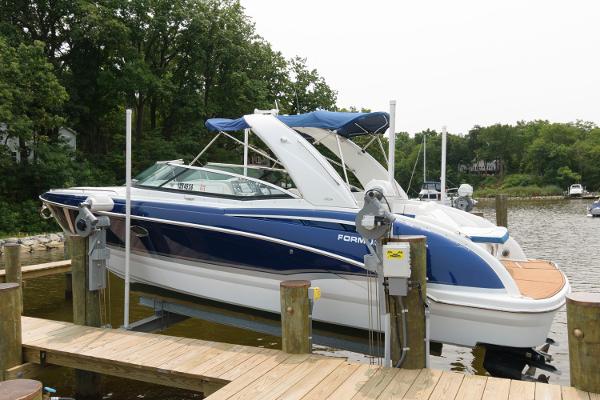 Formula 310 Bowrider 2012 Formula 310 Bowrider boat docked at a marina.