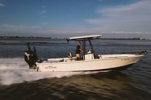 Sea Chaser 26 LX 2021 Sea Chaser 26 LX boat cruising on open water under clear skies.
