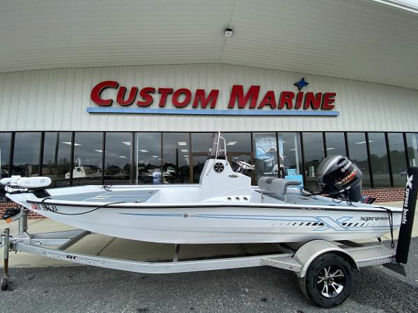 Xpress H190B 2021 Xpress H190B boat on trailer at Custom Marine dealership.