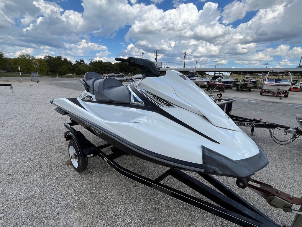 Yamaha Boats VX Cruiser 2016 Yamaha VX Cruiser jet ski on trailer under cloudy sky.