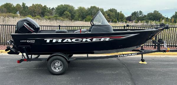 Tracker Pro Guide V-16 WT 2025 Tracker Pro Guide V-16 WT boat on trailer, black exterior, parked outdoors.