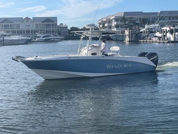 Boston Whaler 270 Outrage 2008 Boston Whaler 270 Outrage boat on water near marina.