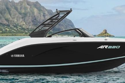 Yamaha Boats AR220 2026 Yamaha AR220 boat on water with scenic mountain backdrop.