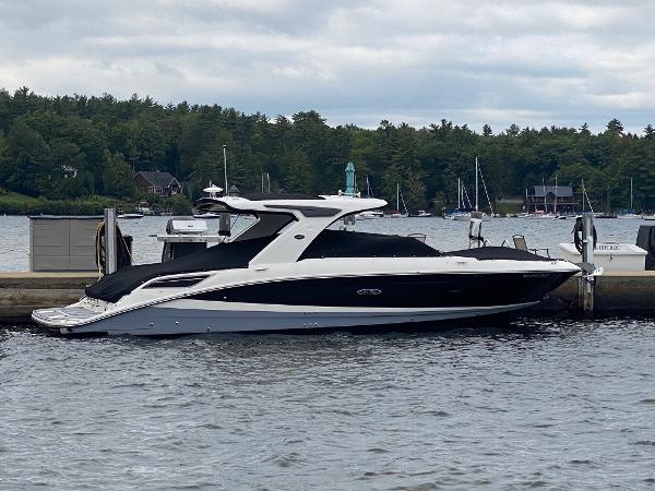 Sea Ray SLX 350 2020 Sea Ray SLX 350 boat docked on a scenic lake.