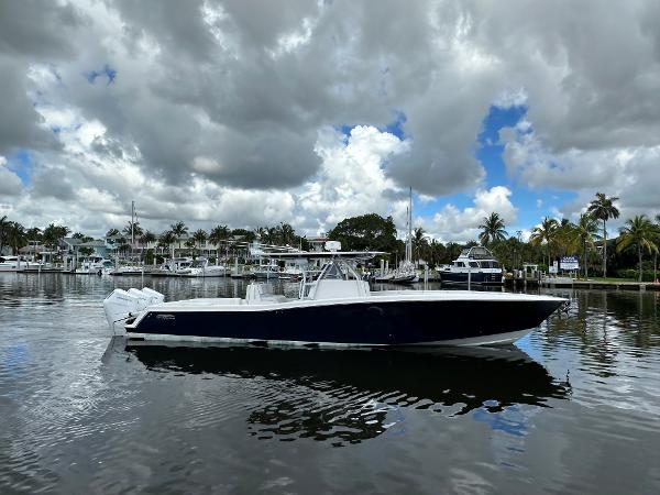 Invincible 42 Open Fisherman 2013 Invincible 42 Open Fisherman boat on calm water, cloudy sky background.