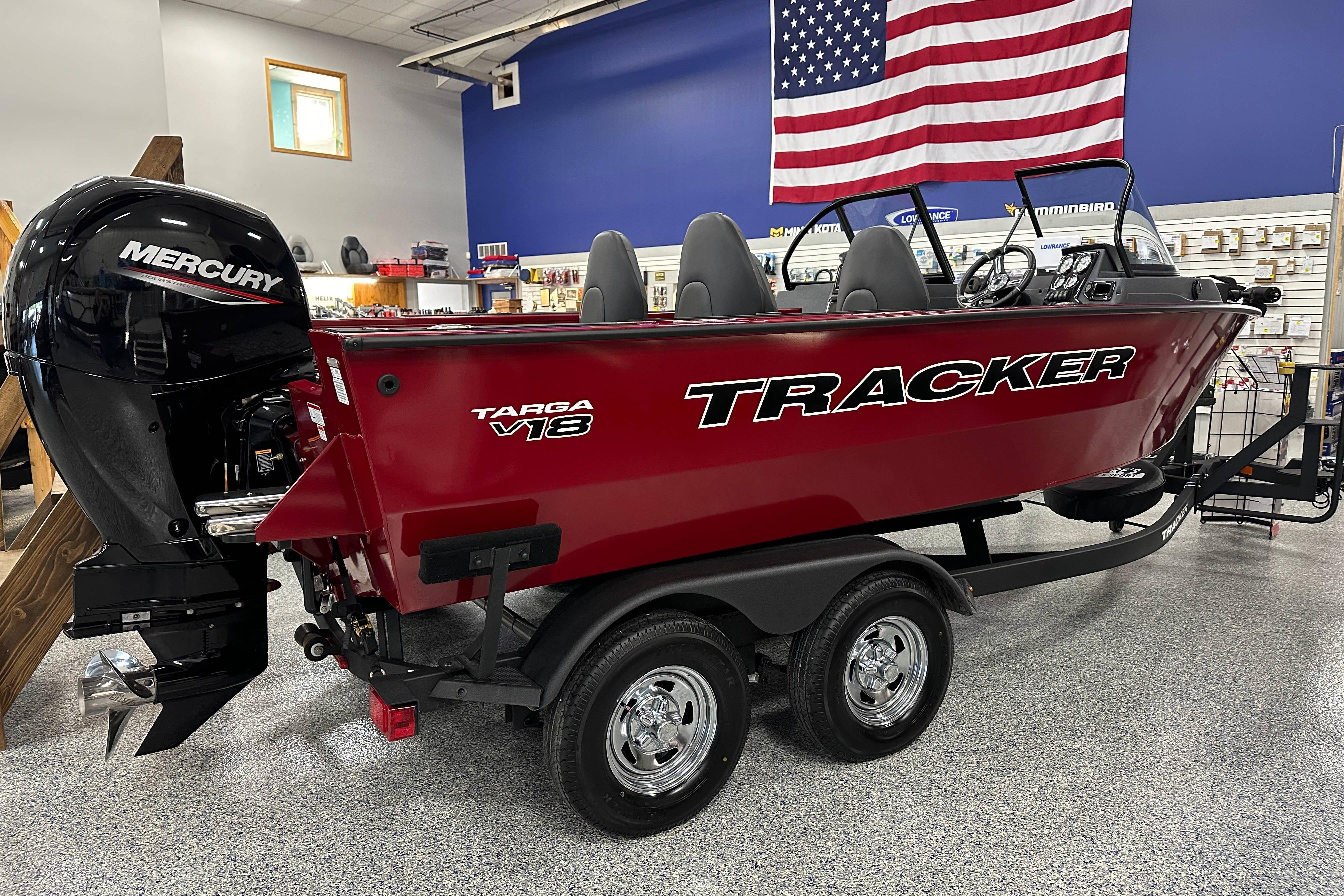 Tracker Targa V-18 WT 2026 Tracker Targa V-18 WT boat with Mercury engine in showroom.