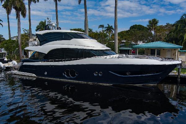 Monte Carlo Yachts MCY 76 Skylounge 2021 Monte Carlo Yachts MCY 76 Skylounge docked, showcasing sleek design and luxury features.