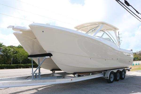 World Cat 296 DC 2025 World Cat 296DC boat on a trailer, parked outdoors.