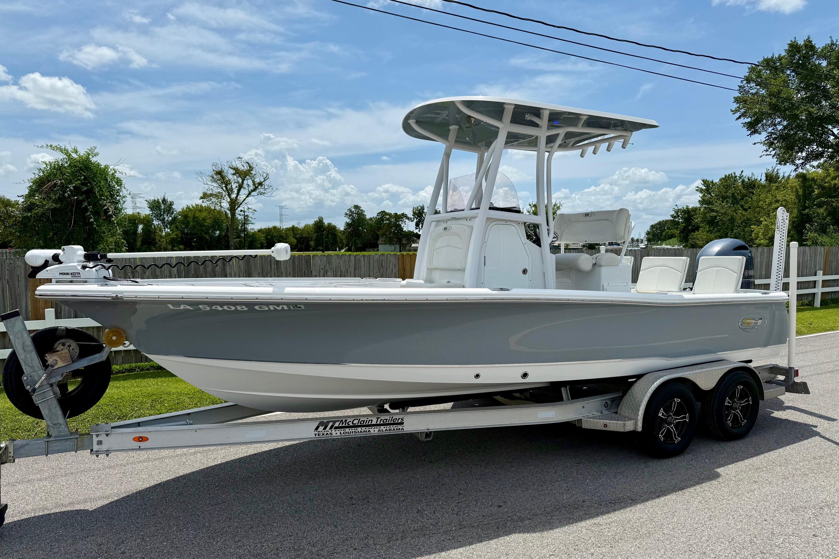 Sea Hunt BX 22 BR 2021 Sea Hunt BX 22 BR boat on trailer, parked outdoors under a clear sky.