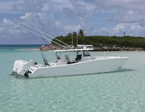 Freeman 43 2024 Freeman 43 boat anchored in clear turquoise water near a small island.
