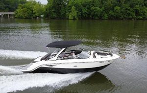 Sea Ray SLX 280 2017 Sea Ray SLX 280 cruising on a calm river with lush green trees.