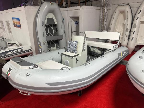 Zar Formenti ZAR Mini RIB 14 2024 Zar Formenti ZAR Mini RIB 14 inflatable boat displayed indoors on red carpet.