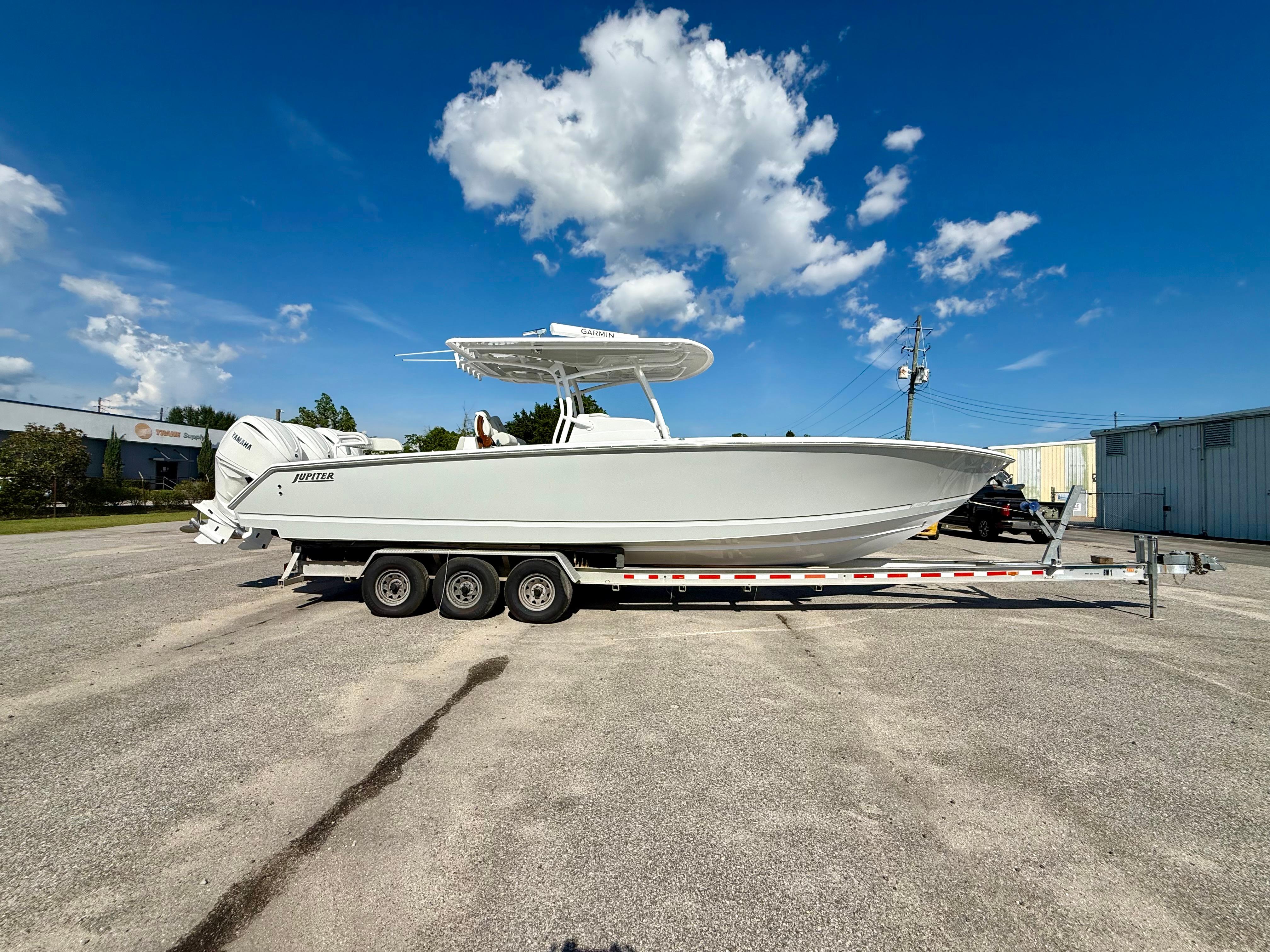 Jupiter 34 2026 Jupiter 34 boat on trailer under clear blue sky.