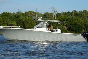 Front Runner 39 Center Console 2024 Front Runner 39 Center Console boat cruising on a scenic waterway.