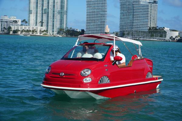 Car Off-shore Fiat 500 Classic Red Fiat 500 Classic boat hybrid on water, city skyline in background, 2025 model.