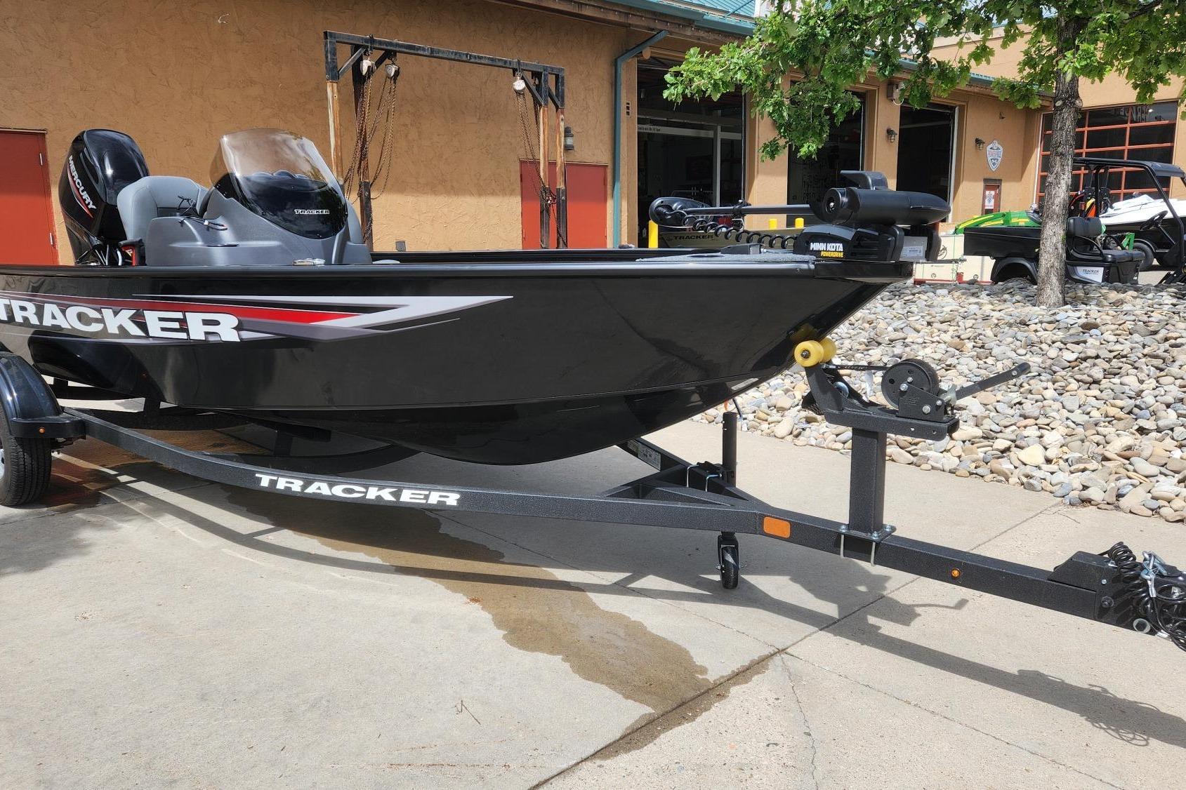 Tracker Super Guide V-16 SC 2026 Tracker Super Guide V-16 SC boat on trailer, parked outdoors.