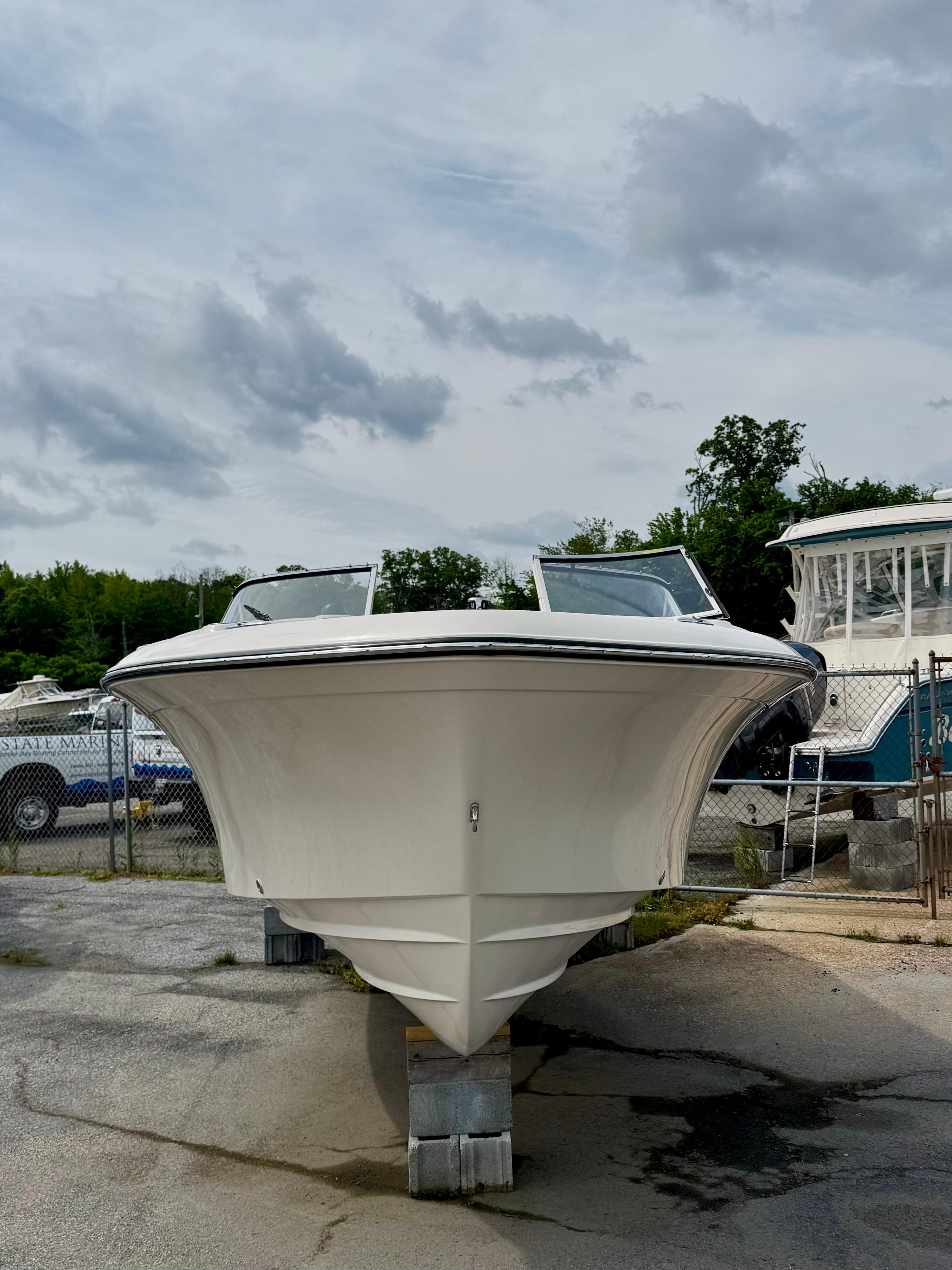 Grady-White Freedom 215 2025 Grady-White Freedom 215 boat on display, front view, outdoors.