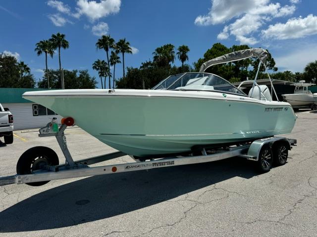 Key West 203 DFS 2026 Key West 203 DFS boat on trailer, parked outdoors under a sunny sky.