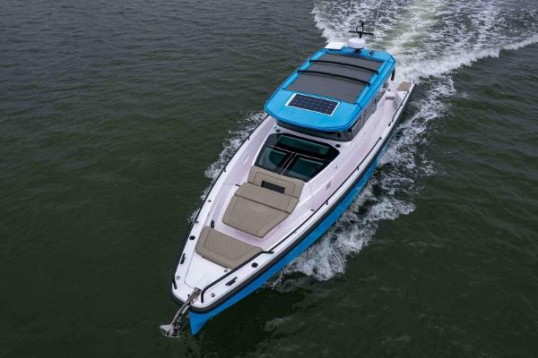 Axopar 37 XC CROSS CABIN 2023 Axopar 37 XC CROSS CABIN cruising on water, featuring sleek design and spacious deck.
