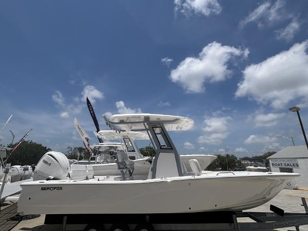 Sea Fox 251 Bay Fox 2025 Sea Fox 251 Bay Fox boat displayed at a dealership under a clear blue sky.