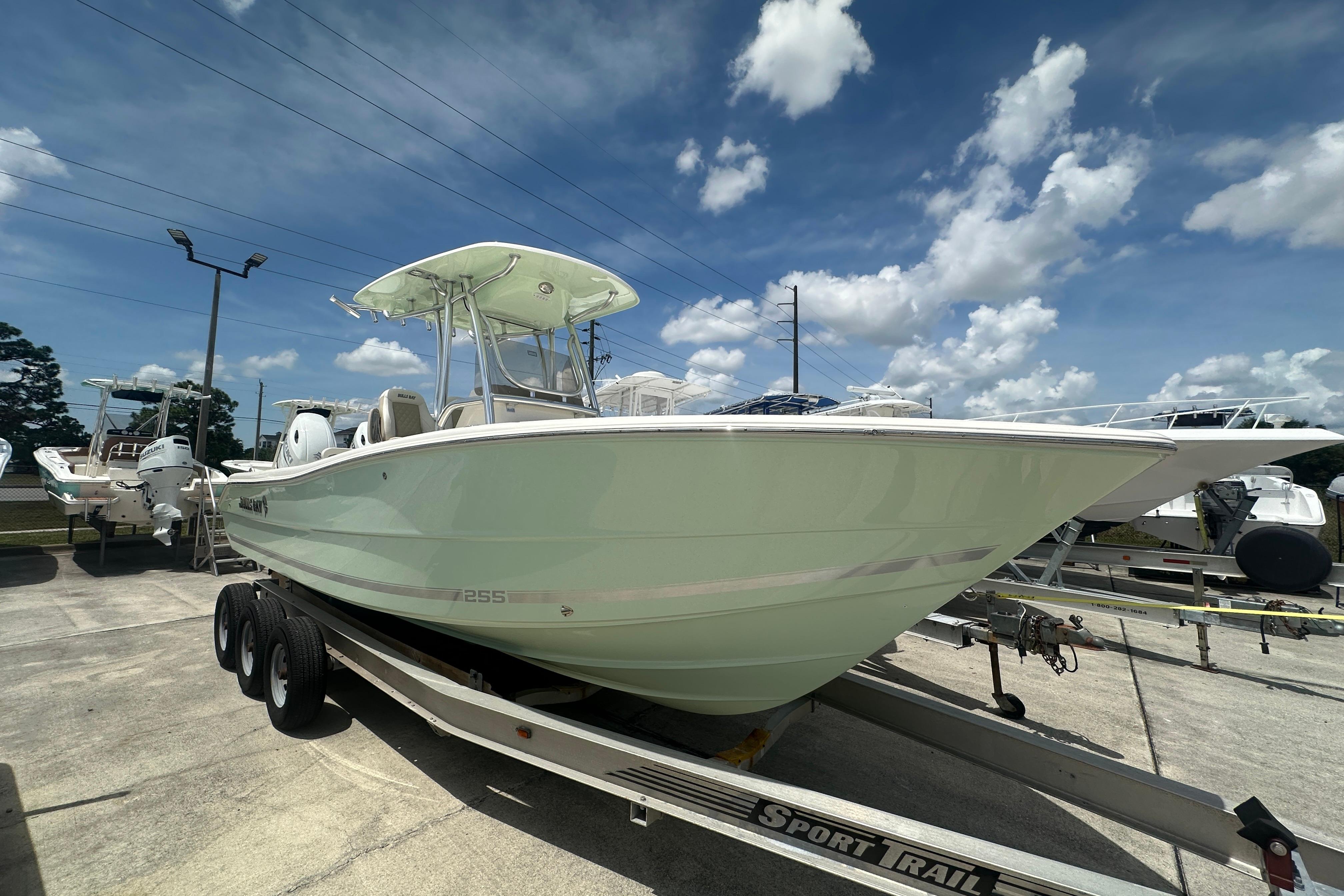 Bulls Bay 255 CC 2026 Bulls Bay 255 CC boat on trailer under blue sky.