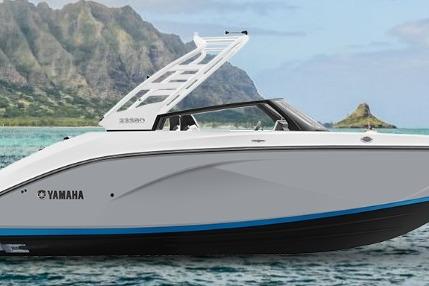 Yamaha Boats 222SD 2026 Yamaha Boats 222SD in scenic coastal waters with mountains in the background.