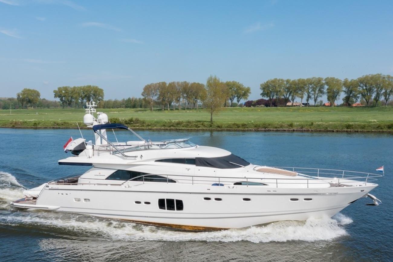 Fairline Squadron 78 Custom 2010 Fairline Squadron 78 Custom yacht cruising on a serene river.