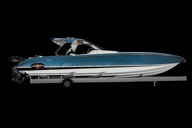 Cigarette 41 Nighthawk 2025 Cigarette 41 Nighthawk boat on trailer, side view, blue and white.