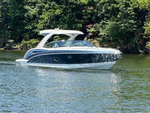 Formula 350 Crossover Bowrider I/O 2023 Formula 350 Crossover Bowrider I/O cruising on a serene lake.
