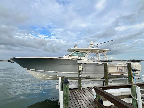 Scout 420 Lxf 2020 Scout 420 LXF boat docked on a cloudy day.