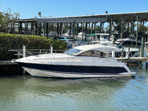 Fairline Targa 38 Open 2013 Fairline Targa 38 Open yacht docked in a marina, surrounded by water and greenery.