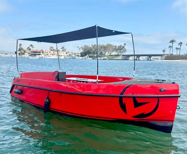 Vision Marine Technologies Volt 180 2023 Vision Marine Technologies Volt 180 boat on water, featuring a sleek red design.