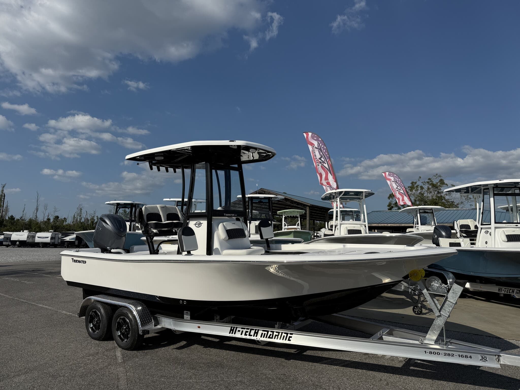 Tidewater 2210 Carolina Bay 2026 Tidewater 2210 Carolina Bay boat on trailer under blue sky.
