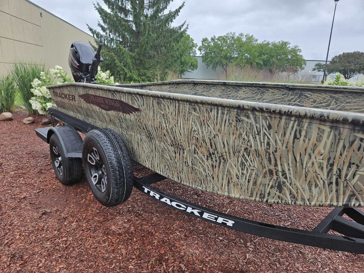 Tracker Grizzly 1650 T Prairie Wings Edition 2025 Tracker Grizzly 1650 T Prairie Wings Edition boat on trailer, camo design, outdoor setting.