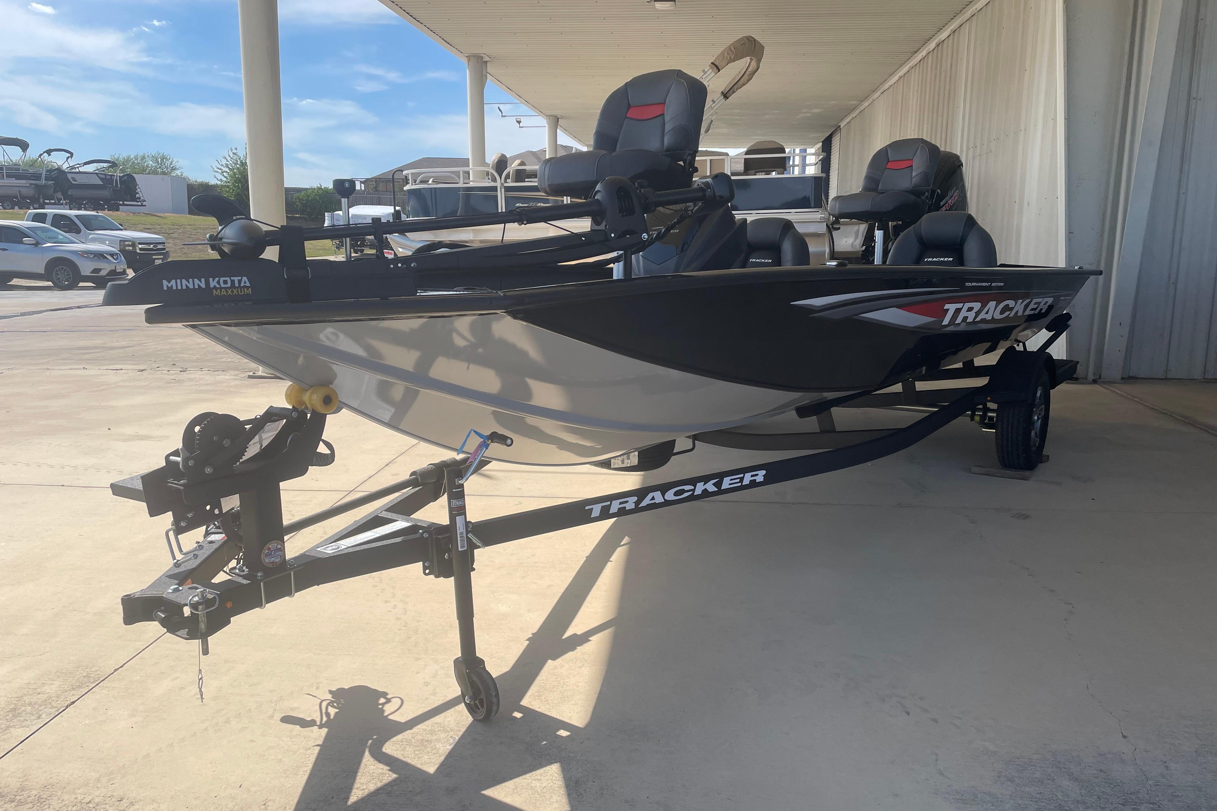 Tracker Pro Team 190 2026 Tracker Pro Team 190 boat on trailer, parked outdoors under a canopy.