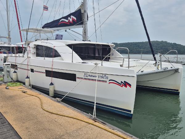 Leopard 40 2020 Leopard 40 catamaran docked at marina, featuring sleek design and modern amenities.