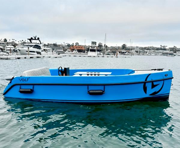 Vision Marine Technologies Volt 180 2023 Vision Marine Technologies Volt 180 electric boat on calm water, marina background.