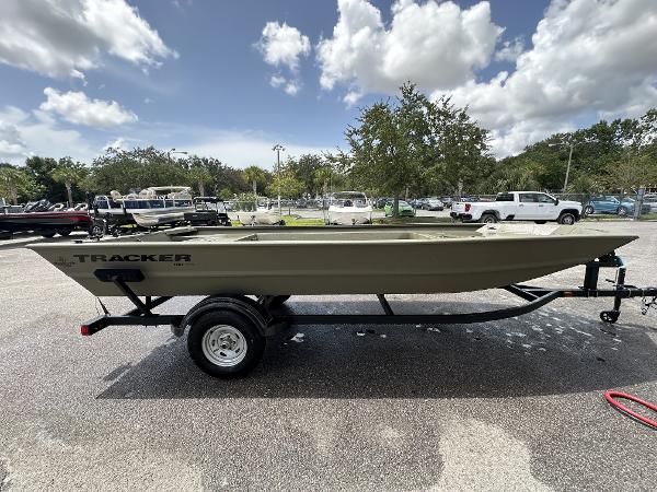 Tracker Grizzly 1754 Jon 2025 Tracker Grizzly 1754 Jon boat on trailer under cloudy sky.