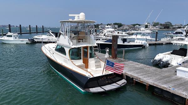 Hinckley Talaria 44 FB 2003 Hinckley Talaria 44 FB yacht docked at a marina with other boats.