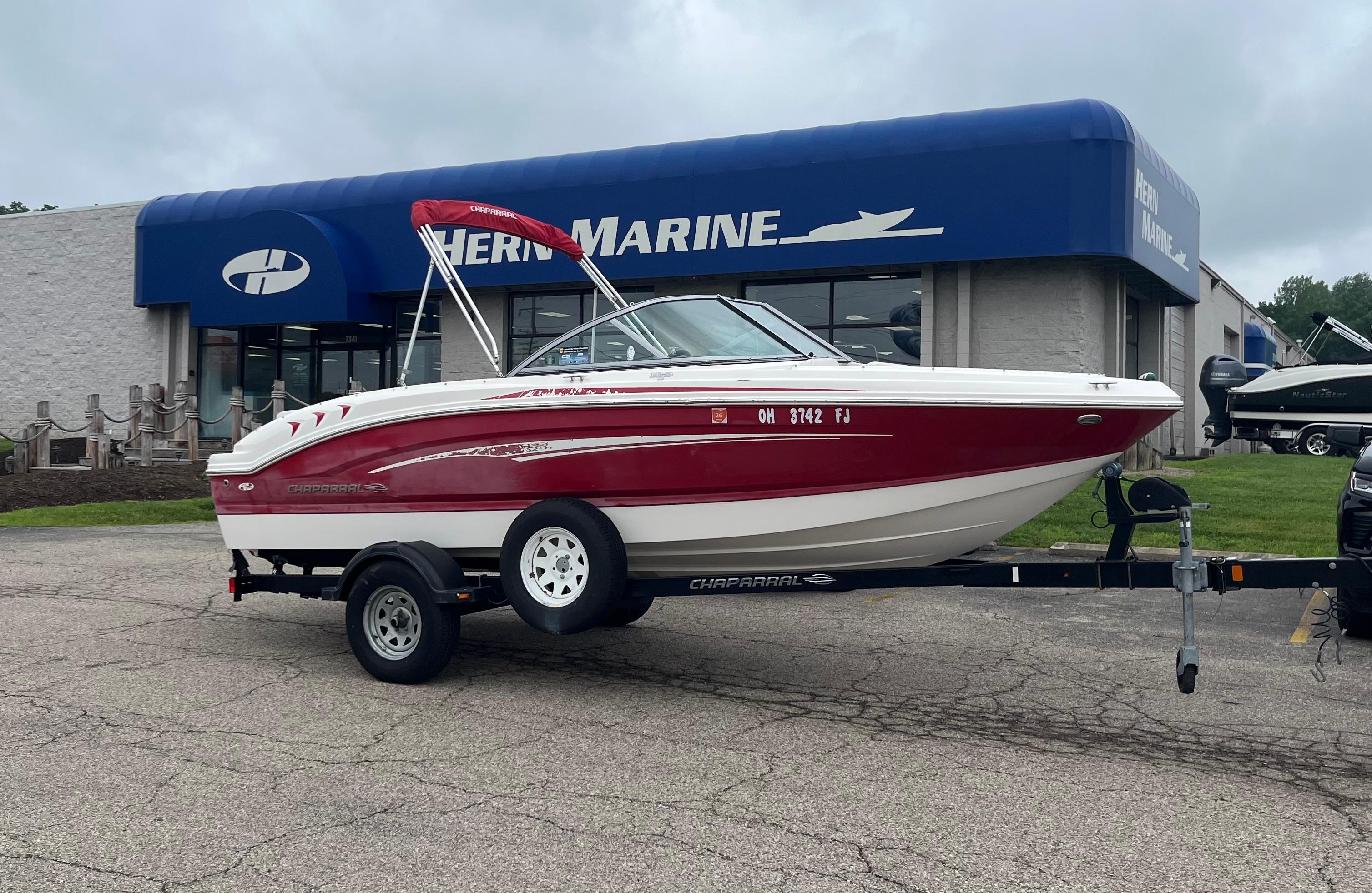Chaparral 19 Sport H2O 2014 Chaparral 19 Sport H2O boat on trailer outside marine dealership.