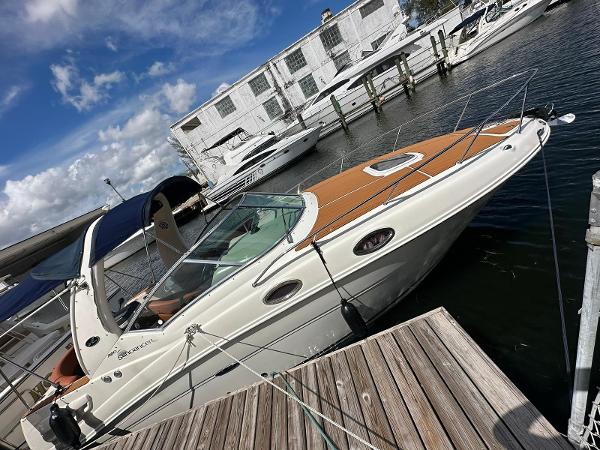 Sea Ray 260 Sundancer 2006 Sea Ray 26 SunDancer docked at marina with blue sky background.