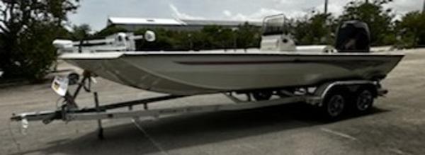 Ranger RB210 2024 Ranger RB210 boat on a trailer in a parking lot.