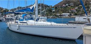 Ron Holland Magnum 46.5 2004 Ron Holland Magnum 46.5 sailboat docked in a scenic marina.