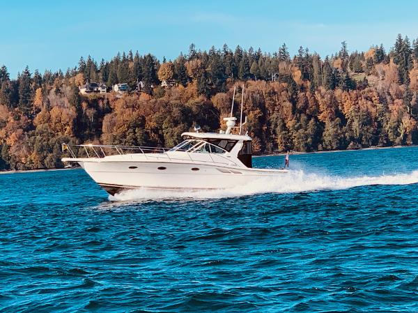 Tiara Yachts 3500 Open 2003 Tiara Yachts 3500 Open cruising on a scenic lake with forested background.