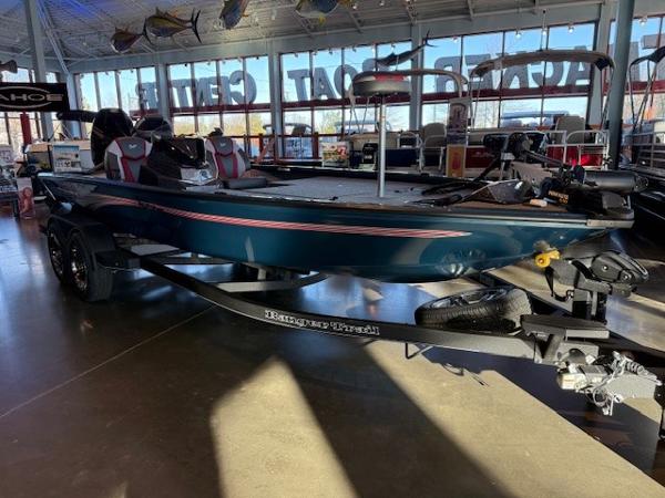 Ranger ALPHA 208 2025 Ranger ALPHA 208 boat displayed in a showroom with trailer.