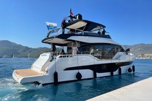 Cranchi Sessantasette 67 Luxury 2023 Cranchi Sessantasette 67 yacht docked in scenic coastal waters.