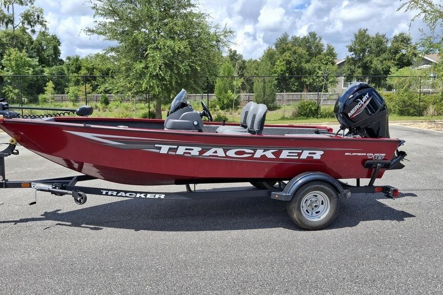 Tracker Super Guide V-16 SC 2026 Tracker Super Guide V-16 SC boat on trailer, parked outdoors.