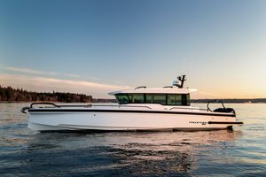 Axopar Axopar 37 XC Cross Cabin 2025 Axopar 37 XC Cross Cabin boat on calm water at sunset.