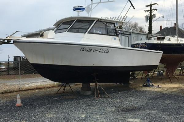 Island Hopper 30 1986 Island Hopper 30 boat named "Meals on Reels" on dry dock.